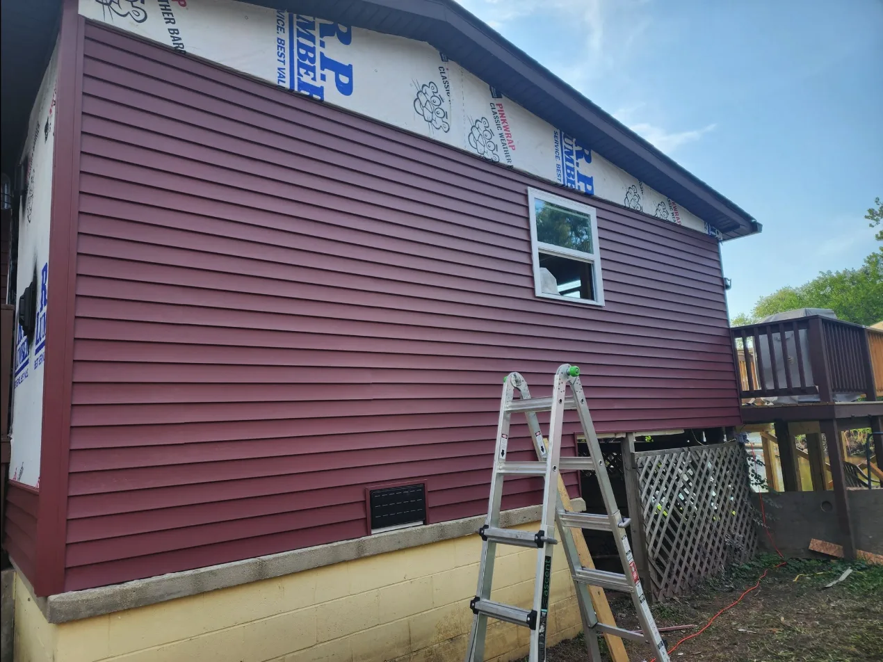 New vinyl siding installation in progress